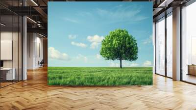 Solitary tree in green field..Lone tree standing in a vast green field under a clear blue sky. AI generative.. Wall mural