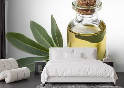 Almond oil in a glass bottle with fresh green leaves and almond nuts, isolated on a white background Wall mural