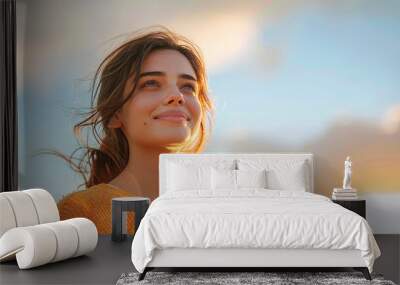 close up low angle portrait of young beautiful blissful woman looking up on sky background Wall mural