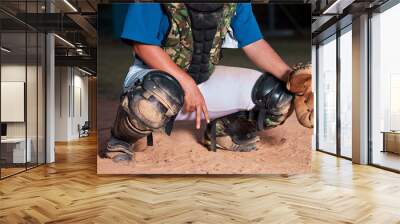 Baseball, player and sign of a sports hand gesture or signals for game strategy showing curveball on a pitch. Catcher holding ball glove in sport secret for team communication during match at night Wall mural