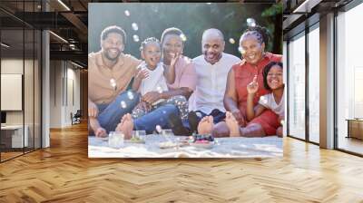 Portrait, happy black family and picnic in summer happiness and bubbles in nature fun and bonding time. Joyful African people smile together in group generations and moments relaxing in the outdoors Wall mural