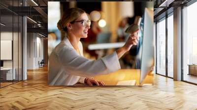 Business woman, computer or hologram screen in night office, financial planning or investment management analytics. Smile, happy or working late on technology abstract 3d or futuristic interactive it Wall mural