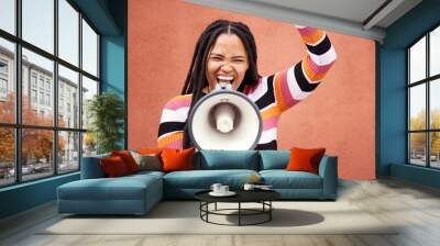 Megaphone, fight or black woman shouting in speech announcement for politics, equality or human rights. Feminist leader, revolution or loud gen z girl speaker fighting for justice on wall background Wall mural