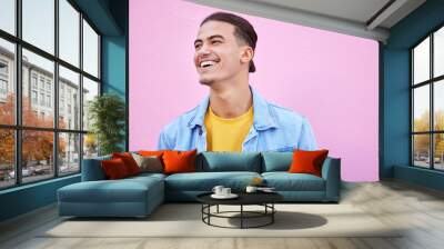 Student man, happy and fashion by background with smile, motivation or lifestyle with vision. Young gen z guy, excited and dream for future with goals, happiness and edgy clothes by pink wall in city Wall mural