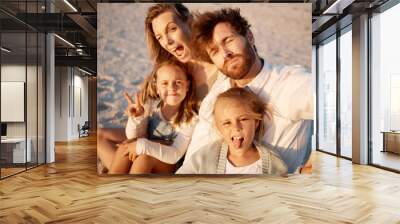 Mom, dad and children in selfie at beach, funny face or smile with care, love or tongue out for summer memory. Father, mother and daughter kids with peace sign, family or portrait on holiday in Spain Wall mural