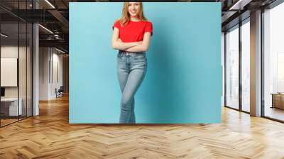 Beautiful young woman on blue background. Full body Wall mural