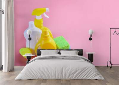 Chemical cleaning supplies on pink background Wall mural