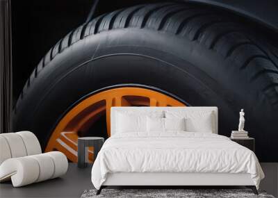 Close-up of a car wheel with metallic orange rim Wall mural