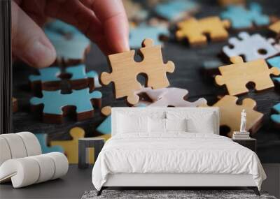 wooden jigsaw puzzle pieces on dark wooden table background Wall mural