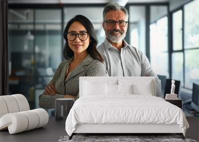 Happy confident professional mature Latin business man and Asian business woman corporate leaders managers standing in office, two diverse colleagues executives team posing arms crossed, Generative AI Wall mural