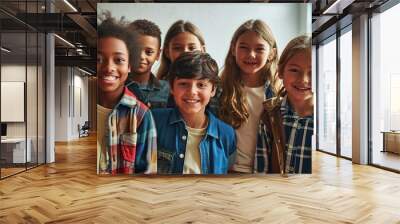 Happy diverse junior school students children group looking at camera standing in classroom. Smiling multiethnic cool kids boys and girls friends posing for group portrait together, Generative AI Wall mural