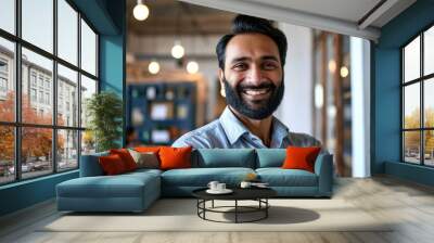 Happy smiling bearded indian business man small business owner, company leader or sales manager, male hispanic ceo executive, successful lawyer looking at camera standing in office, Generative AI Wall mural