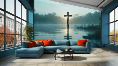 Solitary wooden cross partially submerged in tranquil water with ripples, surrounded by greenery, conveying a sense of peace, faith, and reflection. Wall mural