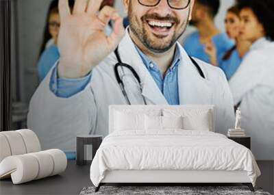 doctor nurse portrait man hospital group team medical uniform health thumbs up approval ok sign smiling professional clinic medicine male happy female occupation teamwork care Wall mural