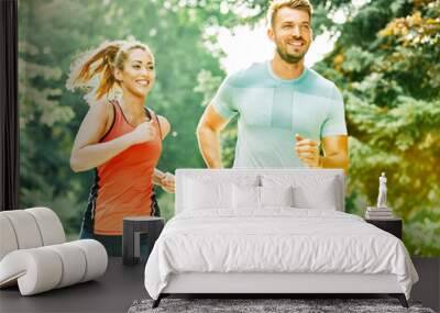 fitness woman park exercise lifestyle outdoor sport healthy couple nature active young fit training athlete man Wall mural