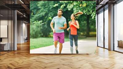 fitness woman park exercise lifestyle outdoor sport healthy couple nature active young fit training athlete man Wall mural