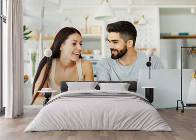 laptop woman man couple computer  indoor technology young together lifestyle happy home love using Wall mural