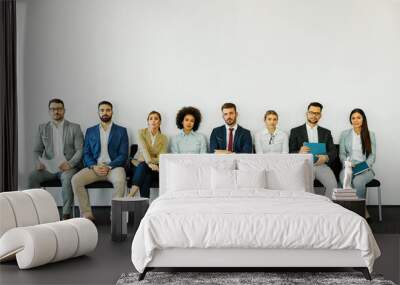 man business chair sitting waiting businessman candidate recruitment office businesswoman woman businessperson job young interview line employee career row hall colleague Wall mural