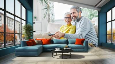 senior couple watching tv happy mature television together Wall mural