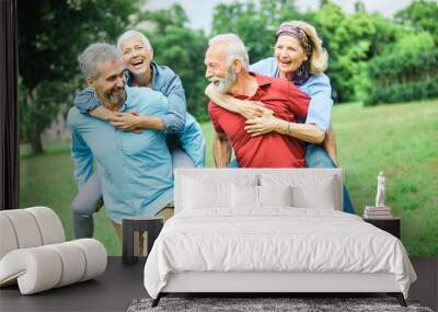 senior people couple happy elderly love together retirement  man woman mature piggyback fun Wall mural