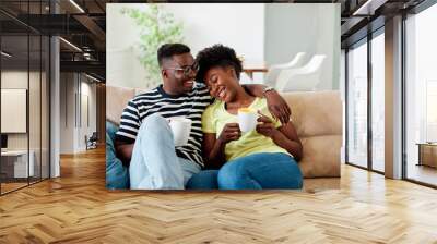 woman couple man happy happiness  love black young lifestyle together romantic boyfriend girlfriend laughing hug coffee tea cup mug Wall mural