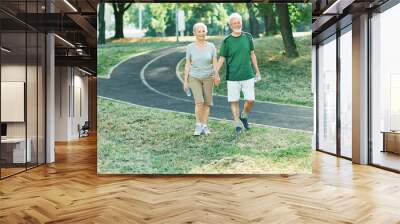 woman senior man outdoor running couple lifestyle sport smiling together jogging healthy nature fit happy active retirement exercise fitness run Wall mural