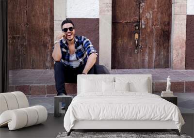 Mexican student in Guanajuato city, exploring a colorful village with a checked shirt.  Wall mural