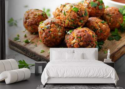 Falafel balls on a wooden cutting board with fresh parsley garnish. Close-up food photography with copy space. Mediterranean cuisine and vegetarian concept design for recipe book, menu, food blog post Wall mural