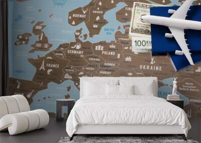 Airplane model, two passports and money. Travel concept on Europe map background. Wall mural