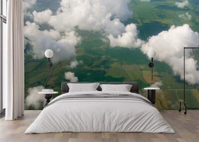 aircraft bird view of green fields white clouds Wall mural