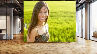 Beautiful brunette indian woman in green rice fields Wall mural