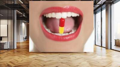 Beauty woman mouth with medicine pill Wall mural