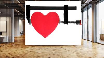 clamp grip tool pressing red heart Wall mural