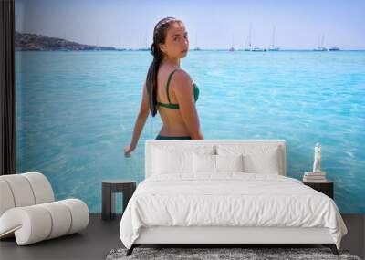 Ibiza bikini girl relaxed in clear water beach Wall mural