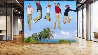 Jumping young people happy group tropical beach Wall mural