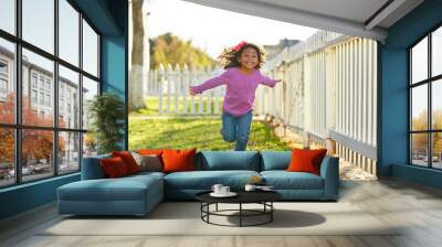 kid girl toddler playing running in park outdoor Wall mural