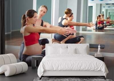 pregnant woman pilates exercise workout at gym Wall mural