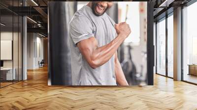 Fitness, gym and excited black man with muscle after workout, bodybuilder training and boxing exercise. Sports, power and strong male athlete flex biceps for muscular body, goals and achievement Wall mural