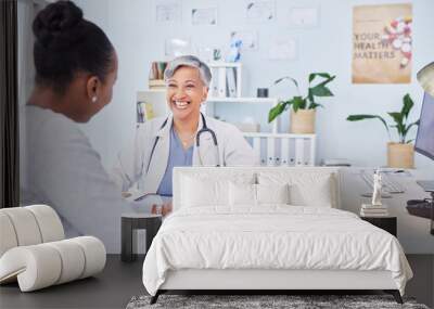 Doctor, patient and talking at happy consultation in hospital with a woman for medical advice. Healthcare worker and person for conversation, results and communication about wellness and health Wall mural