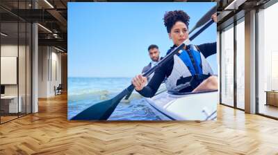 Water, man and woman in kayak at ocean for race at lake, beach or river, exercise in sport. Holiday, adventure and fitness, couple rowing in canoe for training or challenge, mockup on blue sky at sea Wall mural