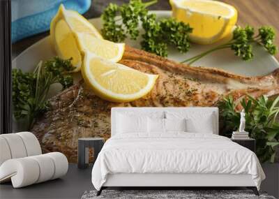 Seawolf or catfish steak with lemons and green parsley Wall mural