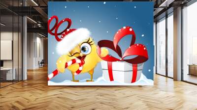 Cartoon Christmas funny little Chick Santa licking candy cane and holding big gift box with bow Wall mural