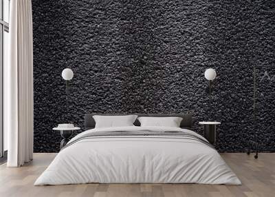 Black porous porous foam background. Background texture of black foam rubber Wall mural