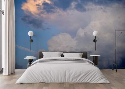 Pre-storm Cumulus blue clouds in the evening sky Wall mural