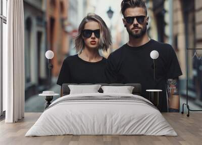 Man and woman wearing blank black t-shirt Wall mural