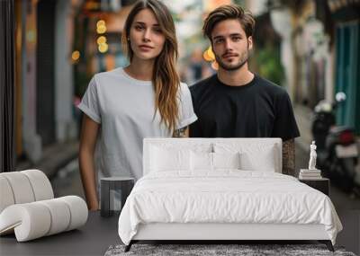 Man and woman wearing blank white and black t-shirt Wall mural