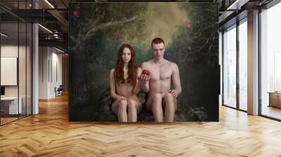 Cinematic portrait of new Adam and Eve. Young man and woman, famous characters holding forbidden fruit, apple on vintage background Wall mural