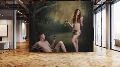 Cinematic portrait of picture Adam and Eve. Man and woman, famous characters holding wine glasses and looking at smartphones on vintage background. Boring party Wall mural