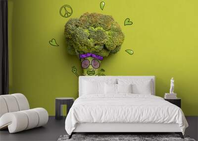 Contemporary art collage of funny hipster broccoli isolated over green background. Drawn doddles on background Wall mural