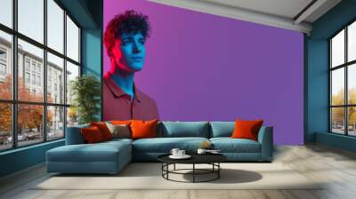 Horizontal banner with portrait of young man over background in neon light. Beauty, fashion, youth concept. Wall mural